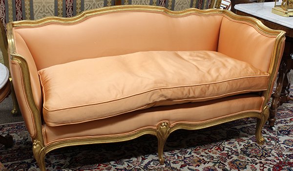 Louis XV style giltwood settee: Louis XV style giltwood settee, having a shaped crestrail, and rising on cabriole legs, 28"h x 50"w x 21"d . Provenance: From the estate of one of the founders of the Lake Tahoe and Reno gaming indust