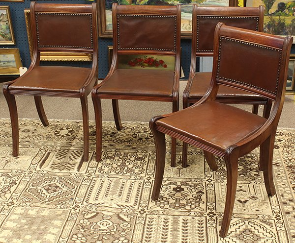 (lot of 4) Biedermeier style side chairs: (lot of 4) Biedermeier style side chairs, each having a contoured back and seat accented with brass nail head trim, and rising on sabre legs, 33"h x 14.5"w x 16"d