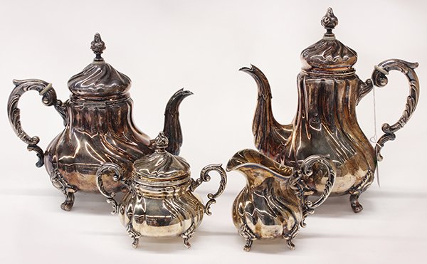 German sterling silver four piece hot beverage service: (lot of 4) German sterling silver four piece hot beverage service, by Emil Hermann, Waldstetten, 1921-1950, consisting of a coffee pot, teapot, covered sugar basin, and cream pitcher, each tapered bul