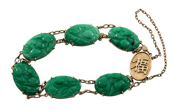 Vintage carved jadeite yellow gold bracelet Mason-Kay: Vintage carved jadeite and 10k yellow gold bracelet consisting of (6) oval carved jadeite plaques each measuring approximately 16.4 x 11.1 x 2.7 mm, accompanied by a Mason-Kay Jadeite Authenticity rep