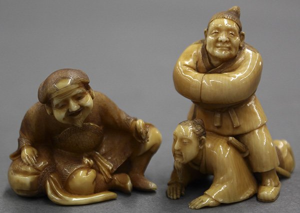 Japanese Ivory Netsuke, Figures: (lot of 2) Japanese ivory netsuke, a man crawling under another's legs, with a signature; and Daikoku (god of wealth) carrying a sack by his side and a mouse on his hand, the signature marked undernea
