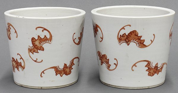 Chinese Porcelain Planters, Bats: Pair of Chinese porcelain planters, the tapering cylindrical form enameled with iron red bats, 5.5"h; Provenance: Estate of Reynold Tom of Oakland, CA