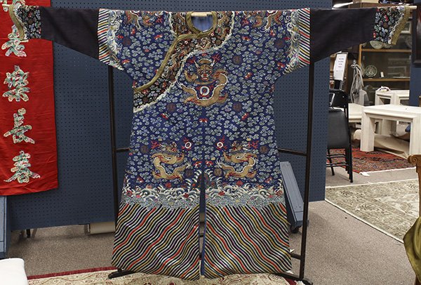 Chinese Blue Dragon Robe: Chinese/Manchu semi-formal embroidered robe (jifu), featruing nine gilt dragons along with shou medallion, bats and clouds on a blue ground, above a lishui border, 56"h