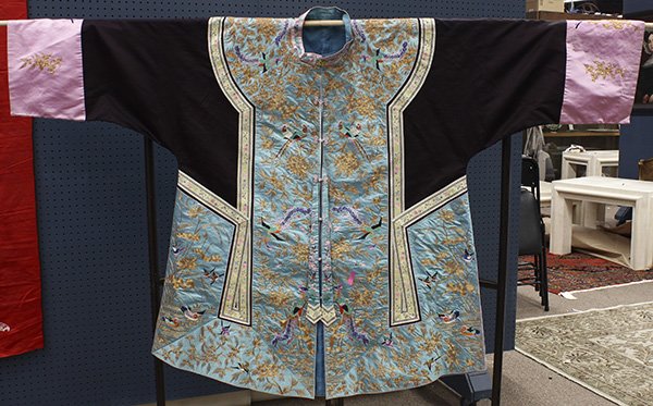 Chinese Couched Turquoise Robe: Chinese woman's turquoise ground robe, the button down front with color thread embroidered birds amid gilt couched peonies, with blue sleeves and pink sleeve bands decorated en suite, 43"h