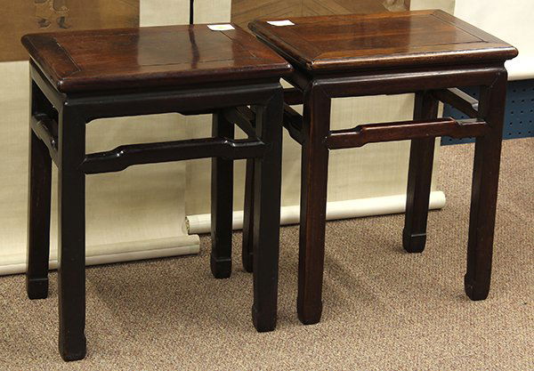 Two Chinese Wood Stools: Pair of Chinese wood stools, the rectangular frame set with a floating panel, each with a plain apron and humpback stretchers, raised on straight supports with hoof terminals, 20.25"h