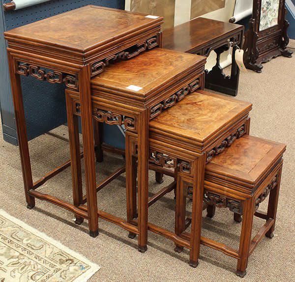 Set Chinese Wood Nesting Tables: (lot of 4) Chinese wood nesting tables, each with a burlwood floating panel, above a scroll apron and raised on slender supports, largest: 29"h