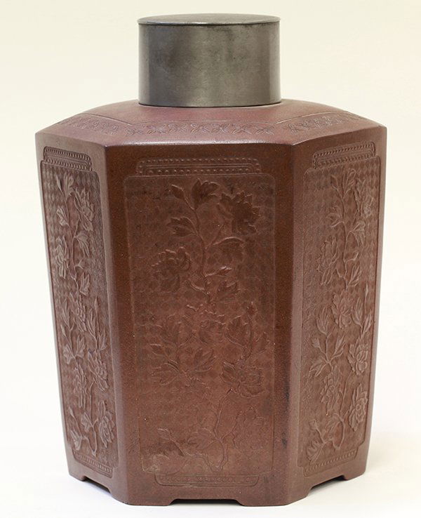 Chinese Zisha Large Tea Caddy: Chinese zisha ceramic tea caddy, of hexagonal section with each panel molded with peonies amid a diaper ground, with a metal lid, overall: 9"h