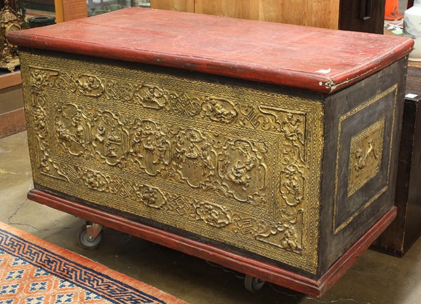 Thai Large Gilt Lacquer Trunk: Thai gilt lacquered wood trunk, with a red hinged top lid, fronted by narrative scenes of Buddhist deities heightened in gilt, 25.75"h x 47.25"w x 25"d