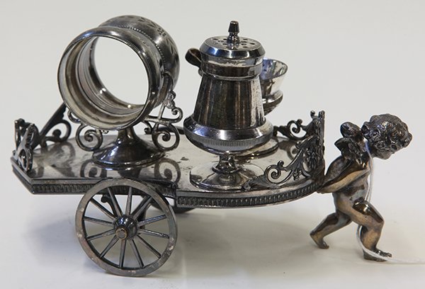 Simpson, Hall, Miller & Co silver plate figural: Simpson, Hall, Miller & Co .silver plate figural combination napkin ring, circa 1880, with salt cellar, pepper shaker, and tongs, in the form of a cherub pulling a cart, 4.5"h x 8"l x 3.5"d.