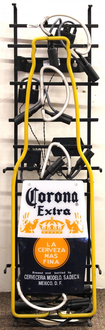 Corona Extra neon beer sign: Corona Extra neon beer sign, depicting the Corona bottle with a yellow bottle, 33"h x 10"w. Provenance: The Jeff Sahadi collection