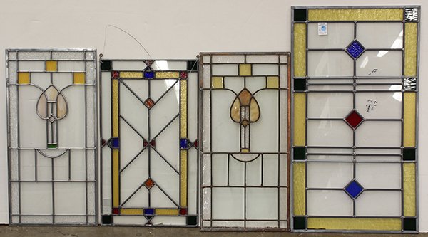 Pop Art style stained glass windows: (lot of 7) Arts and Crafts style stained glass windows, having abstract designs in yellow, blue red and green, largest: 34"h x 20"w. Provenance: Original designs from the Gabilan Glass Company, Berkel