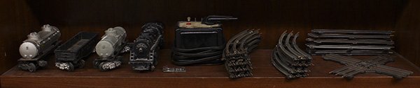 Lionel train and train accessories: (lot of 25) Lionel train and train accessories, including a locomotive, (2) Sunoco tankers, and an open bed car along with 'O' scale track and a Train master transformer. Provenance: The Jeff Sahadi c