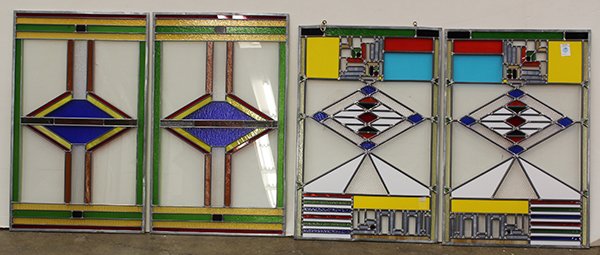 Pop Art style stained glass window inserts: (lot of 4) Pop Art style stained glass window inserts, having repeating geometric patterns in green, red, yellow, azure and white, 30"h x 20"w