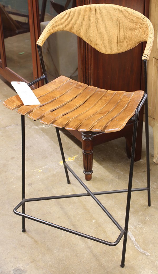 (Lot of 2) Arthur Umanoff bar stools: (Lot of 2) Arthur Umanoff bar stools, circa 1950, having a rush back, continuing to the slat-form birch seat, and rising on a painted steel frame; smaller: 36"h x 17"w x 14"d, larger: 39"h x 19"w x 14