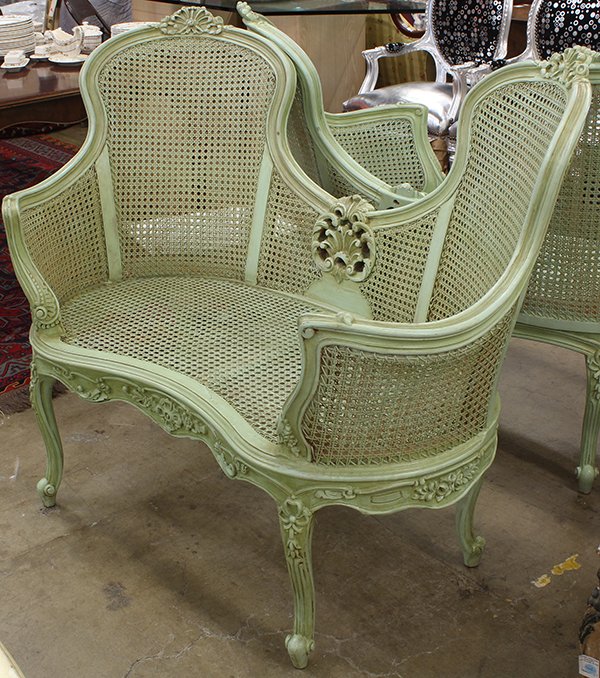 Pair of Rococo style polychrome decorated settees,: Pair of Rococo style polychrome decorated settees, the carved and shaped crestrails with a shell medallions surmounting the cane supports, and rising on cabriole legs accented with bellflower drops, 3