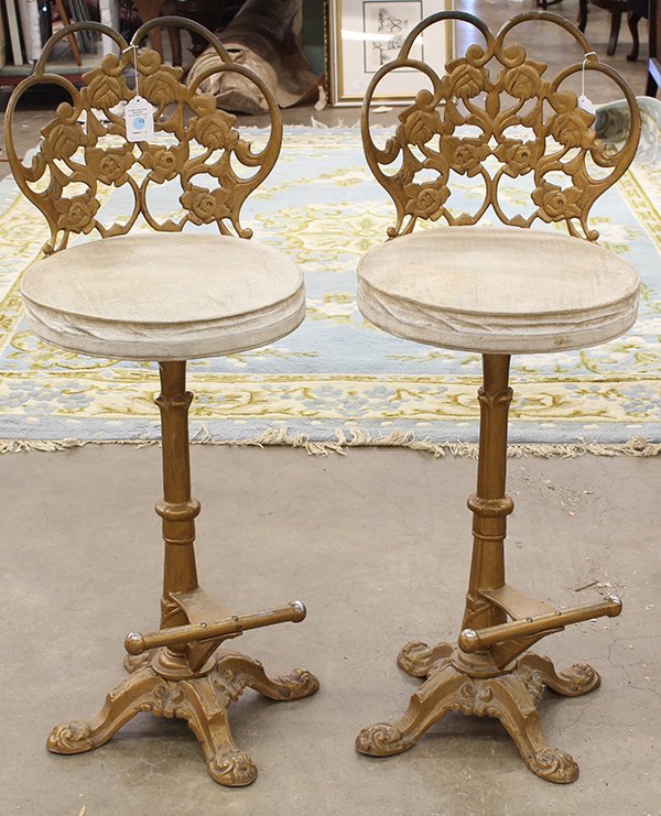 Pair of Neo-Classical style gilt metal stools: Pair of Neo-Classical style gilt metal bar stools having pierced floral scroll backs, mounted with foot rests, and having a cream velvet upholstered seat