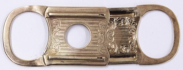 Victorian 14k yellow gold cigar cutter: Victorian 14k yellow gold cigar cutter, decorated by a linear and scroll engraving, measures 2 1/8 x 7/8 inches, stamped 14k Pat. Pend., 6.6 grams. Provenance: The Jeff Sahadi collection