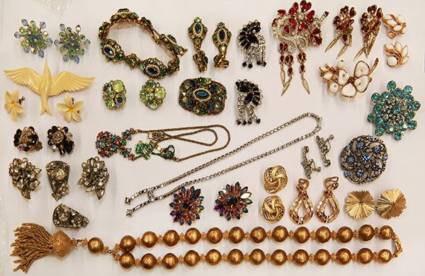 Collection of costume jewelry: Collection of mostly rhinestone accented fashion jewelry including three pairs of earrings, one bead and gilt tassel necklace, two brooch and earrings suites all marked Trifari; A pair of ear clips, t