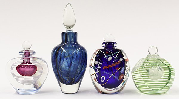 Group of art glass stoppered bottles: (lot of 4) Group of art glass stoppered bottles, consisiting of an urn form bottle with blue and brown waves captured in clear glass with a tear drop ground stopper, signed Nowak (James Nowak) and dat