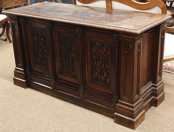Continental Neo-Gothic style carved oak coffer.: Continental Gothic Revival carved oak coffer, 19th century, having a hinged top surmounting the rectangular case accented with pierced panelled reserves and turned stiles, flanked by stepped geometric