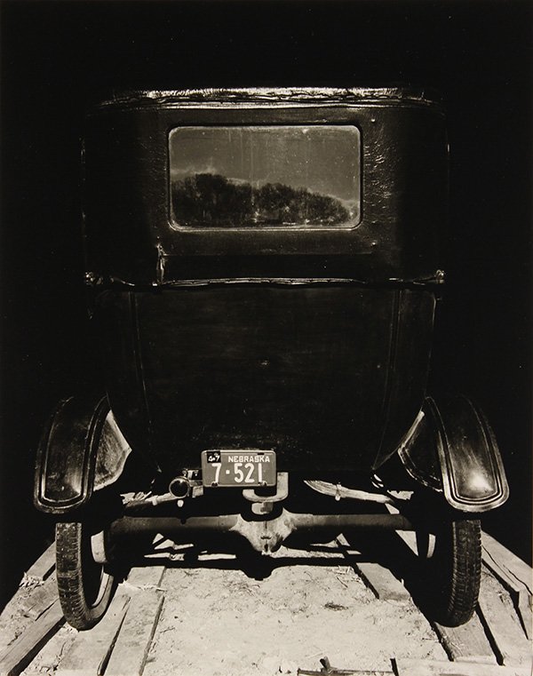 Photograph, Wright Morris, Model T in Shed (1947): Wright Morris (American, 1910-1998), "Model T in Shed, the Home Place, Nebraska (1947)," gelatin silver print, signed in pencil verso, later reprint, sheet (unframed): 10"h x 8"w, overall (with mat): 
