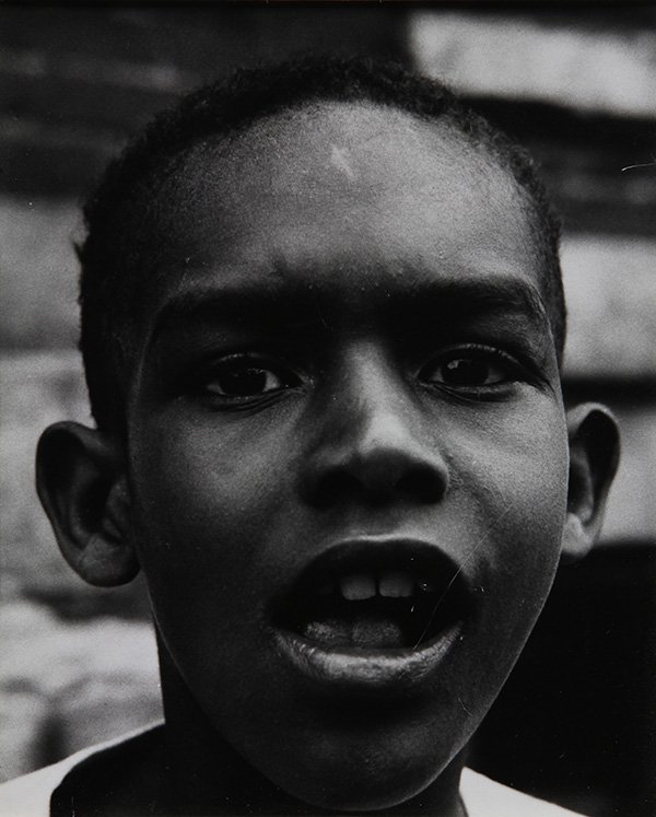 Photograph, Aaron Siskind, Portrait of a Boy: Aaron Siskind (American, 1903-1991), "Portrait of a Boy," gelatin silver print, initailed and inscribed verso, sheet (unframed): 7"h x 4.75"w, overall (with mat): 9"h x 6.5"w. Provenance: The David C.