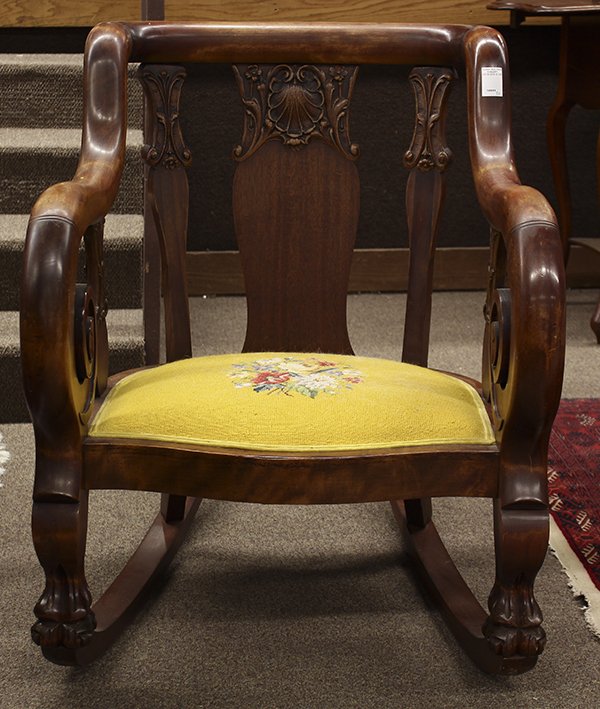Late Victorian rocking chair: Late Victorian rocking chair, executed in mahogany circa 1890, having a curved crestrail continuing to the inswept returns, surmounting the relief carved splats accented with shell and floral medallio