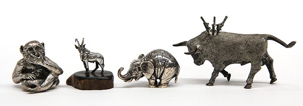 Sterling silver minitaure sculptures of animals: (lot of 4) Sterling silver miniature sculptures of animals, consisting of a seated monkey and an elephant by Buccellati; a Mexican bull, and a mountain goat mounted to a wood base, 7.6 troy oz. Proven