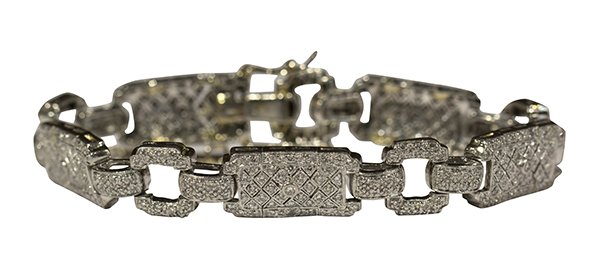 Diamond platinum bracelet: Diamond and platinum bracelet is set with numerous full cut diamonds weighing in total approximately 2.70 cts., set in a platinum art deco style mounting, clasp is stamped PT900, length 6 3/4 inches, 