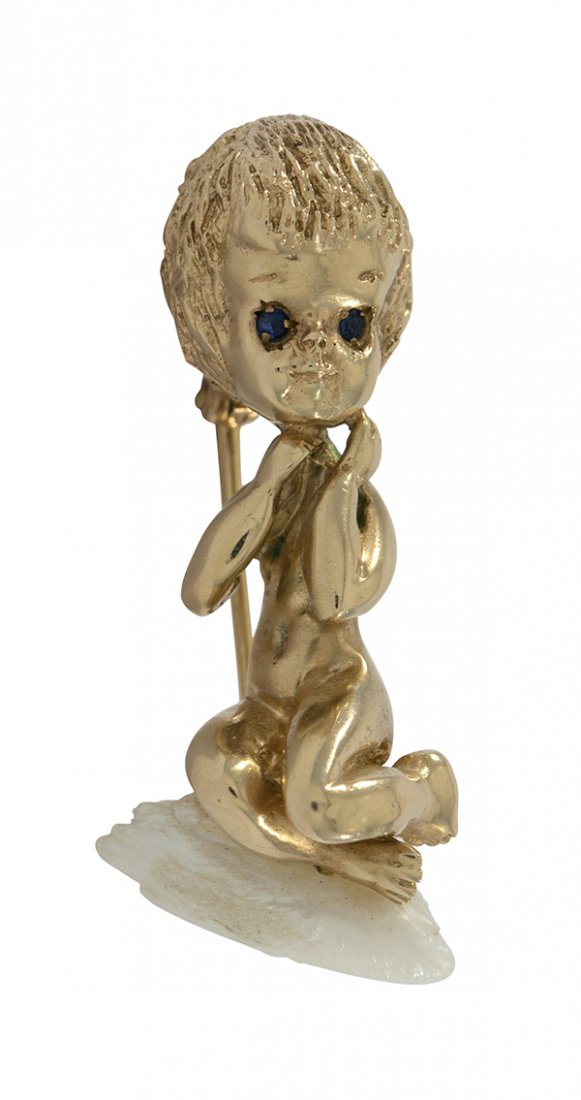 Ruser yellow gold brooch: William Ruser "Monday's Child" figural 14k yellow gold brooch featuring a cherub figure kneeling on a natural freshwater pearl, signed Ruser 1 1/2 inches, 10.4 grams