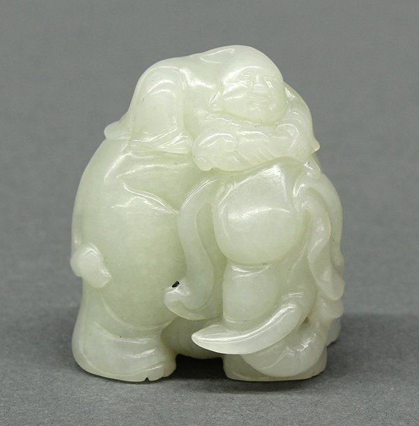 Chinese Jade Carving, Child/Elephant: Chinese celadon jade figural carving, of a child carrying a ruyi scepter laying on the back of an elephant, 1.75"h