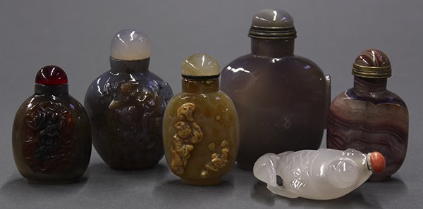 Six Chinese Agate Snuff Bottles: (lot of 6) Chinese agate snuff bottles, one consisting of a frosted white gold fish; the second with a pair of bats and a coin; the third with purple bands; the fourth carved with a child with a lingz