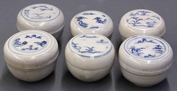 Six Vietnamese Ceramic Boxes: (lot of 6) Vietnamese/Annamese underglaze blue ceramic circular boxes, each with a riverside mountain landscape to the lid, the base with sticker 'Hoi An Hoard', largest: 2.75"w