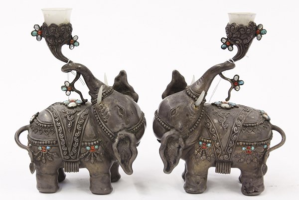Pair of East Indian figural candle holders: Pair of East Indian figural candle holders, executed in silverplate depicting elephants, with trunks raised holding frosted hard stone cups, the bodes with inlaid mother of pearl, coral, and turquoise
