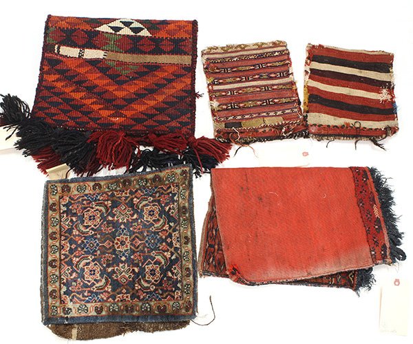 Persian carpet group consisting of a small Sarouk: (lot of 5) Tribal carpet group consisting of saddle bags, salt bags, etc. largest: 30" x 16". Provenance: The Jeff Sahadi collection