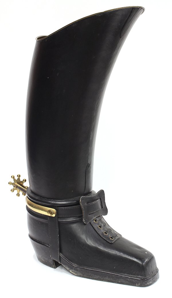 Continental style riding boot umbrella stand: Continental style figural umbrella stand, the brass riding boot form covered in black leather, 25"h. Provenance: Property from a private collection to benefit Honolulu Museum of Arts