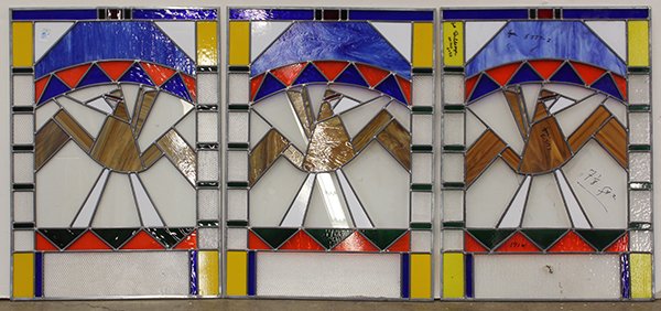 Pop Art style stained glass windows: (lot of 3) Pop Art style stained glass windows, having an abstract design in brown slag glass with yellow, red and white, and blue, 38"h x 27"w; together with two demi-lune panels executed in blue and