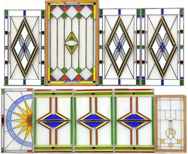 Pop Art style stained glass window inserts: (lot of 9) Pop Art style stained glass window inserts, having repeating geometric patterns executed in various primary colors including green, red, yellow, azure and white, largest: 36"h x 22"w