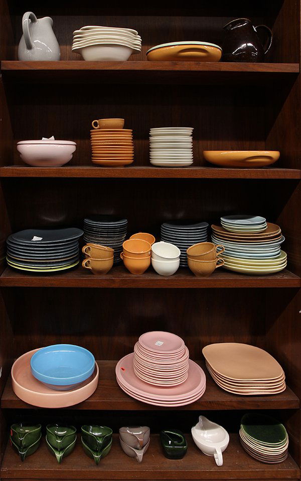 Five shelves of mid-century pottery tableware by: (lot of approx 158) Five shelves of mid-century pottery tableware by Baurer, Garden City and Franciscan, including Russel Wright dinnerware in pink, grey, yellow, blue, tan, and cream, Franciscan plat