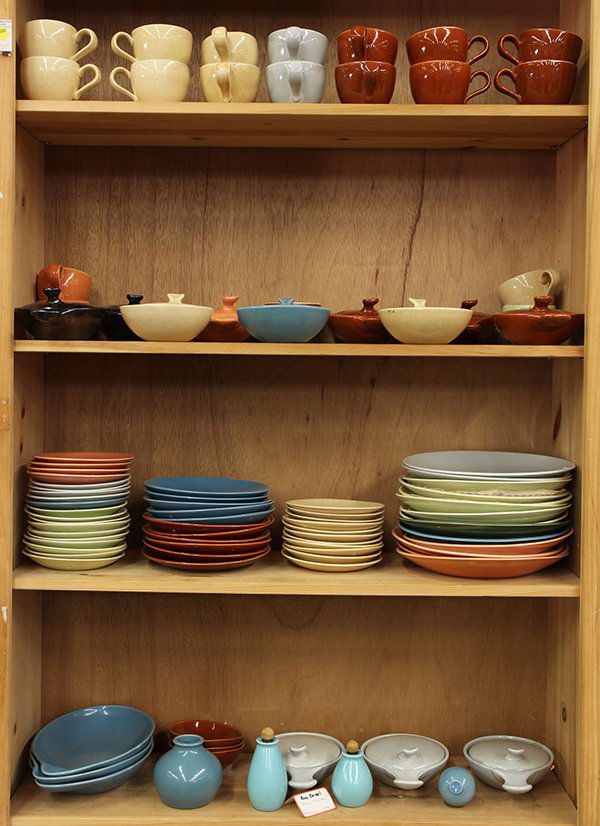 Eva Zeisel "Town and Counry" pottery tableware: (lot of 80) Collection of Eva Zeisel "Town and Counry" pottery tableware in brown, cream, blue, salmon, gray, incluidng dinner, salad, bread plates; saucers, cups, covered casseroles