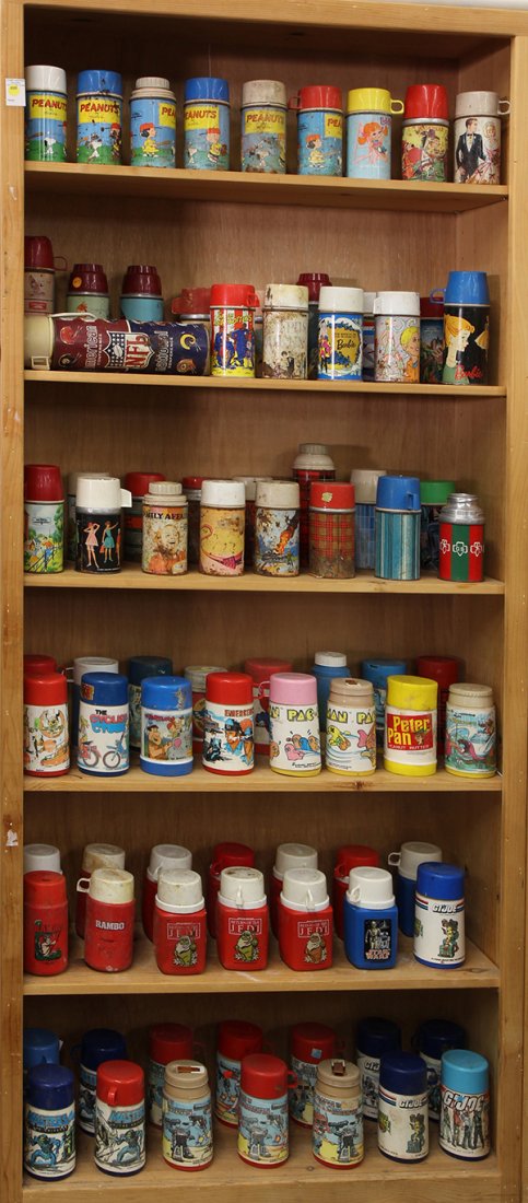 Collection of vintage metal and plastic thermoses: (lot of 83) Collection of vintage metal and plastic thermoses including Peanuts, Pac-Man, GI Joe, Return of the Jedi, Star Wars, Harlem Globe Trotters, Barbie, NFL, Flintstones, Transformers, Peter Pa