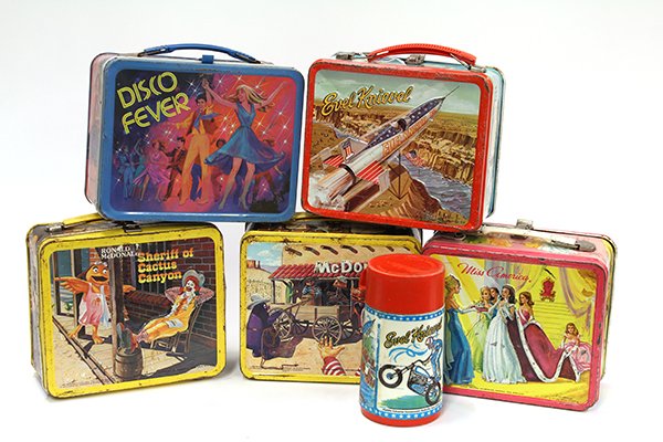 Vintage metal lunch boxes: (lot of 5) Vintage metal lunch boxes consisting of Miss America, 1972; Disco Fever, 1980; two McDonald's, 1982; and Evel Knievel with thermos, 1974, 7"h x 8"w x 4"d (paint and oxidation losses)