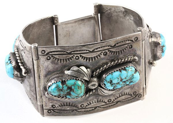 Native American turquoise and silver bracelet: Native American turquoise and silver bracelet Featuring (6) nugget turquoise cabochons measuring approximately 19.5 X 10mm to 15 X 10mm, set in a three-panel bracelet, 6 1/2" X 1 1/2 ", 86.9 grams