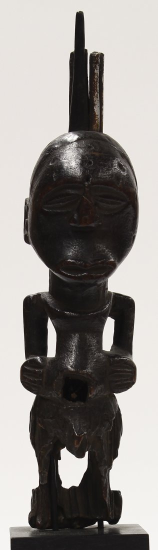 Songye Tribe, D.R. Congo wood fetish figure: Songye Tribe, D.R. Congo, small wood fetish figure, with some fetish accoutrements, and kneeling with arms at sides, eroded, 10.5"h; Provenance: Long held in a prominent San Francisco collection