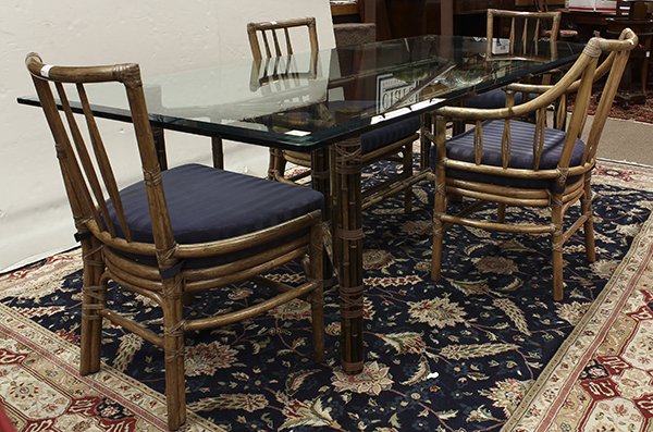McGuire dining table: McGuire, San Francisco, dining suite, the table having bevelled plate glass top above a conjoined rattan base with a central box stretcher, 29"h x 96"w x 41.25"d, together with four chairs having a dr