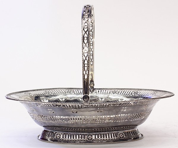 Georgian sterling silver basket, by William Potter,: Georgian sterling silver basket, by William Potter, London, 1781, the reticulated oval form executed in the Adam's style featuring rosette medallions, pierced urn reserves, and incised swags, the poli