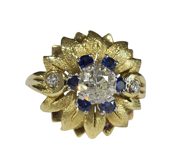 Vintage diamond synthetic sapphire yellow gold platinum: Diamond, 18k yellow gold and platinum ring centered by (1) old European cut diamond measuring 6.5 mm and weighing approximately 0.96 ct., accented by (6) small synthetic sapphires, further enhanced by