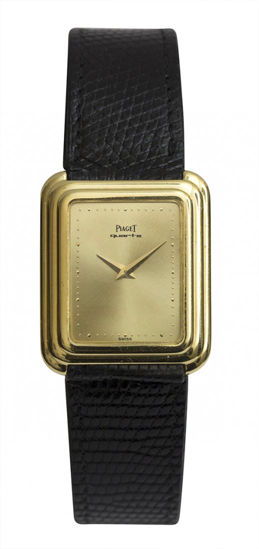 Gentleman's Piaget yellow gold quartz wristwatch,: Gentleman's Piaget 18k yellow gold quartz wristwatch, 1970's having a champagne dial, dot minute track, dauphine hands, quartz movement signed Piaget #93419 7P3, cushion shaped 18k yellow gold case he