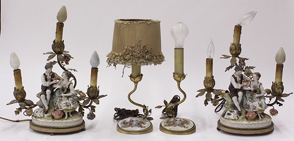Continental porcelain figural table lamps: (lot of 4) Continental porcelain figural table lamps, consisting of a pair each having three lights above the polychrome decorated base depicting a courting couple in a naturalistic scene; together wi