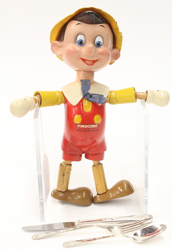 Ideal Pinocchio doll: (lot of 4) Ideal Pinocchio doll, circa 1940 executed in painted composition and wood, with original felt hat, having decal reading 'Pinocchio, DES, & Copyright By Walt Disney, Made by Ideal Novelty &